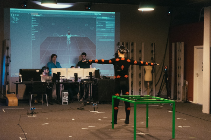 Image 4. Jonathan D. Mellor being scanned with a mocap suit